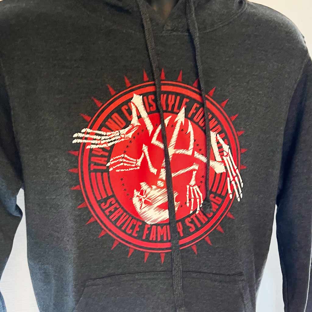 Up-close taya and chris kyle foundation bone frog red circle graphic