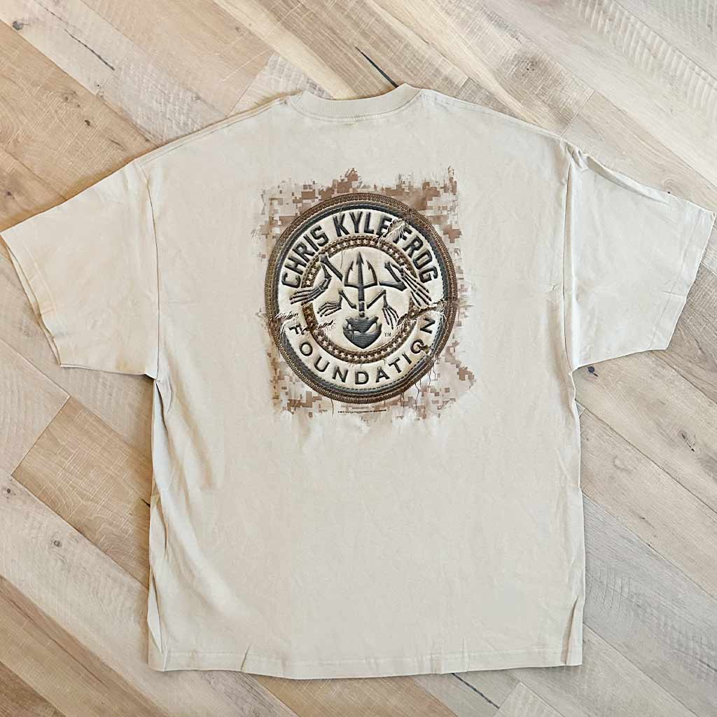 Tan shirt Chris Kyle circle logo surrounded by digi camo in brown