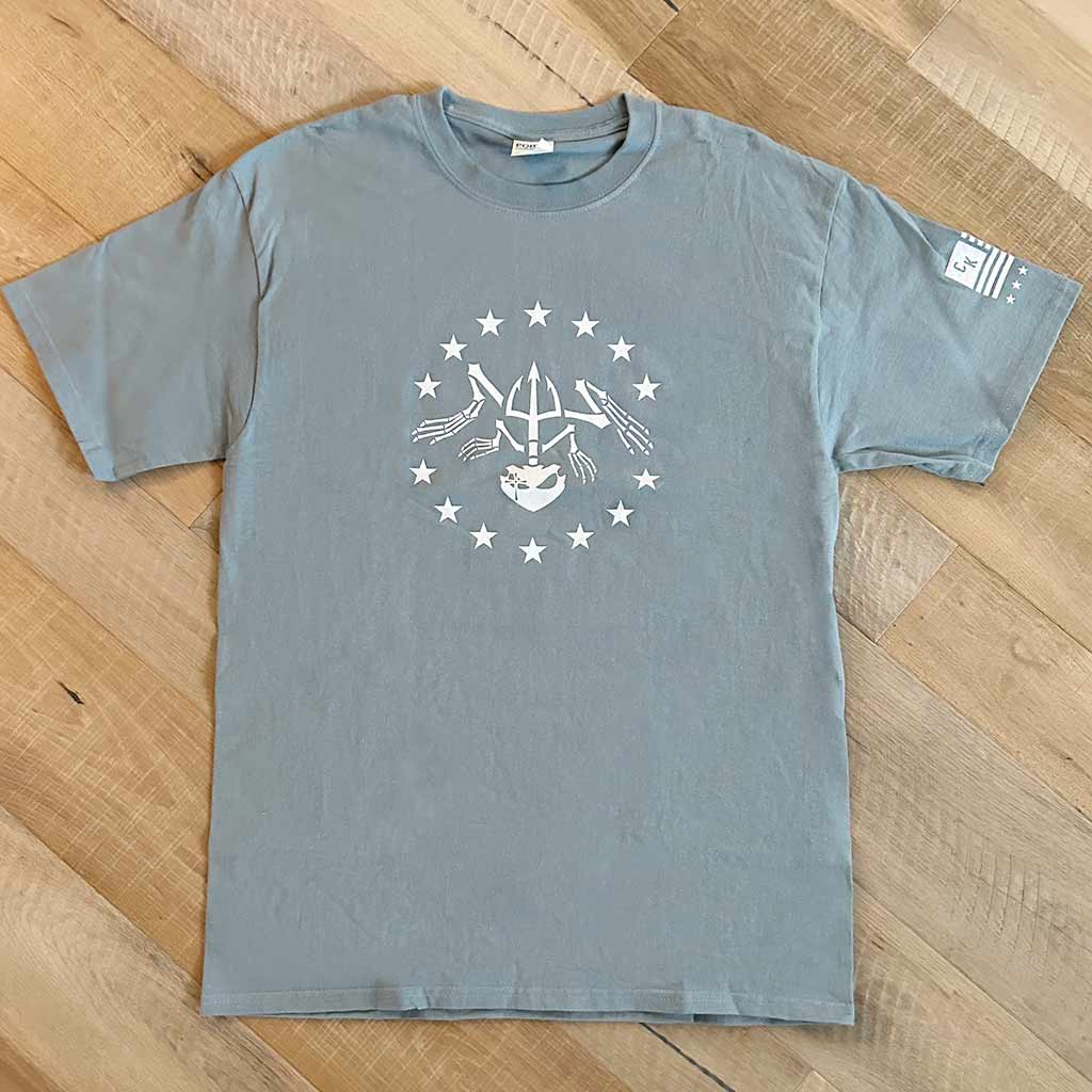 Blue-Grey shirt with a bone frog surrounded by stars