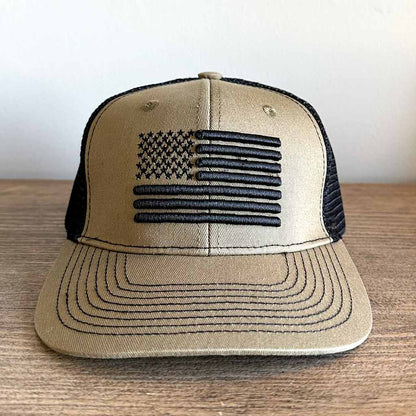 Tan and Black Mesh hat with a embroidered black American flag