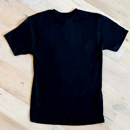 Black back of t-shirt on wood background
