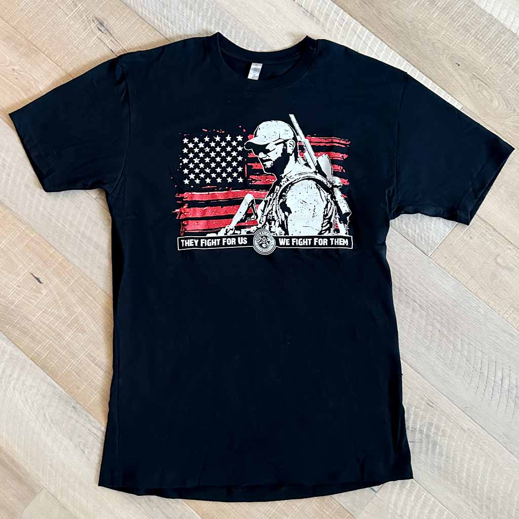 Black shirt with a white Chris Kyle's Silhouette in front of a red American flag