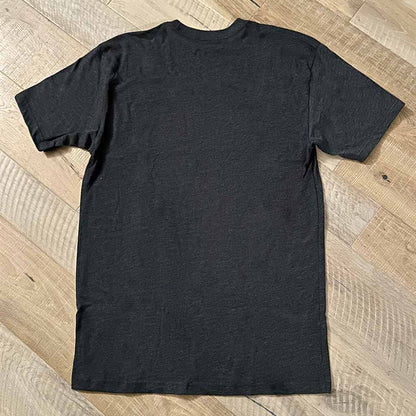back of dark grey t-shirt on wood background