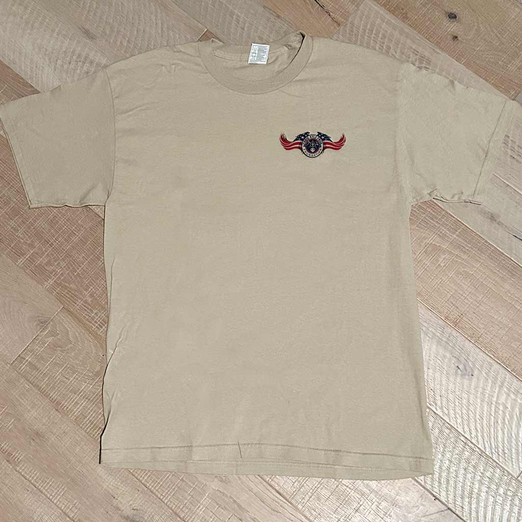 Tan shirt with Chris Kyle American flag wing logo on left chest