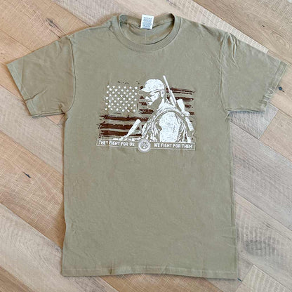 Front of Tan shirt with a white Chris Kyle's Silhouette on top of a brown flag graphic