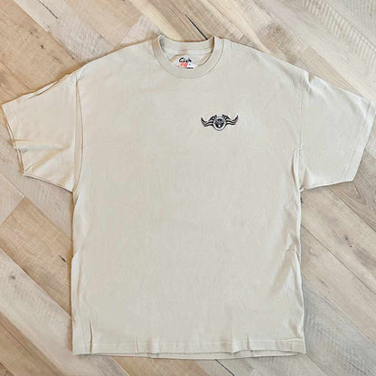 Tan shirt with black Chris Kyle graphic on top chest