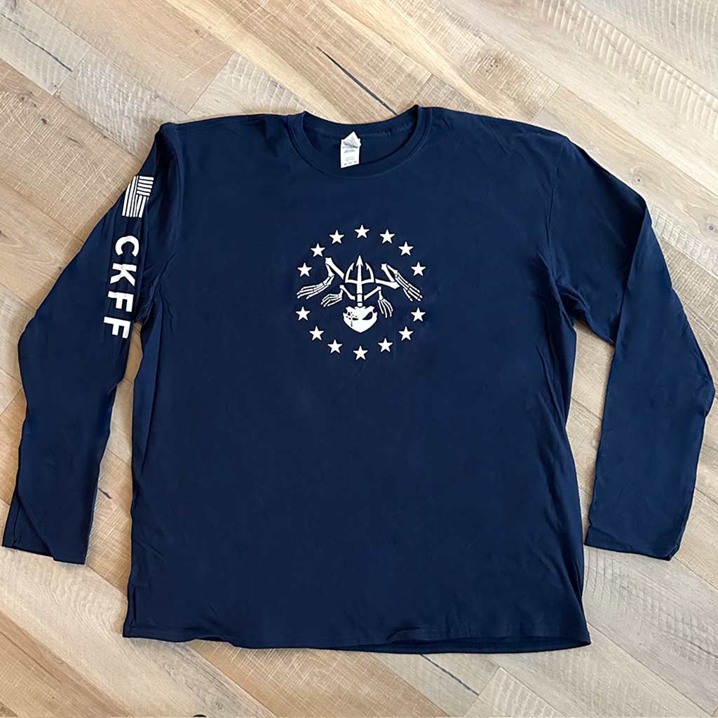 Long sleeve navy shirt with a white bone frog surrounded by stars