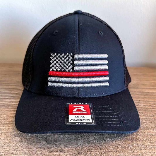 Black hat with an embroidered grey American flag with one red line